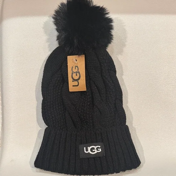 UGG NWT Accessories. Cable Knit Beanie with Faux Fur Pom. Color: Black - Picture 1 of 2